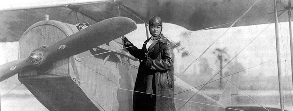 Bessie Coleman and her plane.