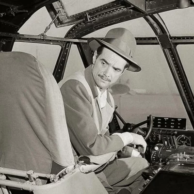 Hughes sitting in the pilot seat of the legendary Spruce Goose.